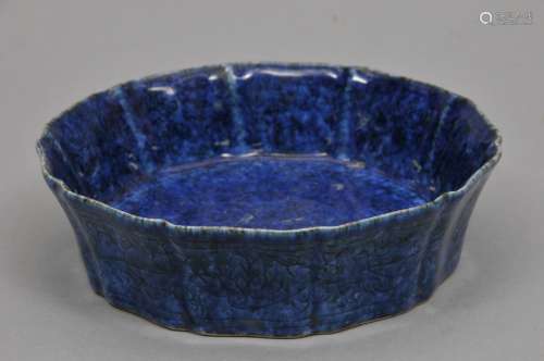 Porcelain bowl. China. 19th century. Lobated form. An hua decoration of lotus flowers. Sapphire blue glaze. 7