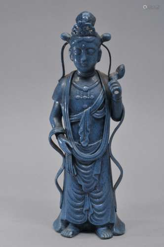 Porcelain figure. China. Early 20th century. Standing figure of the Buddhist Divinity Padmapani. Monochrome blue glaze. 9