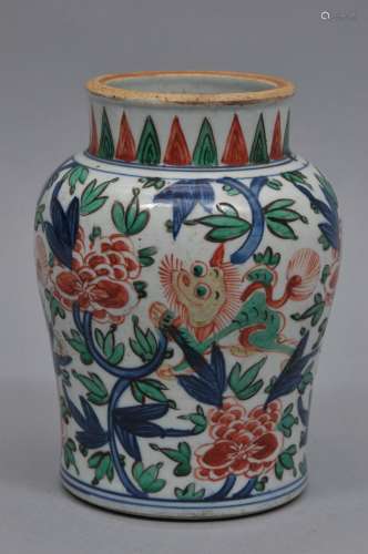 Porcelain vase. China. Transitional style but probably 19th century. Baluster form Wu Tsai decoration of foo dogs and peonies. 7