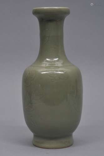 Porcelain vase. China. 19th century. Carved decoration of birds and flowers. Celadon glaze. Drilled for a lamp. 9-1/2