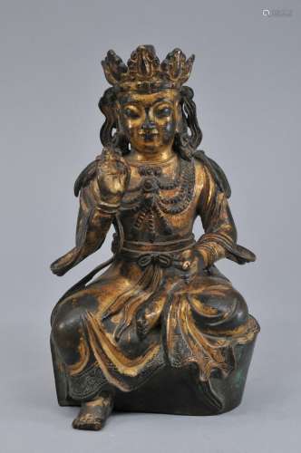 Gilt bronze Buddha. China. 20th century. Seated figure in princely jewelry. Hsuan te six character mark on the back. 7