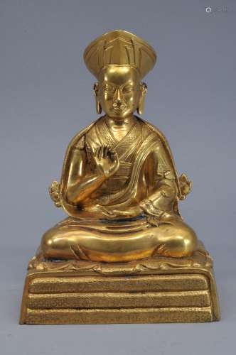 Gilt bronze image. Tibet. 19th century (?) Figure of a seated high Lama. Finely engraved surfaces. 9-1/2