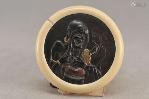 Kagamibuta Netsuke. Japan. 19th century. Mixed metal