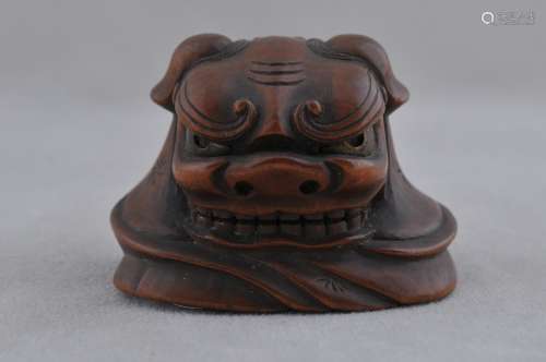 Carved wooden Netsuke. Japan. 19th century. Shishi mask