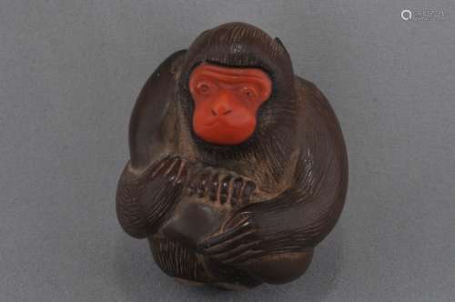 Carved wooden Netsuke. Japan. 19th century.Monkey with