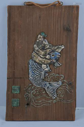 Wooden plaque. Japan. 19th century. Pottery inlay of a