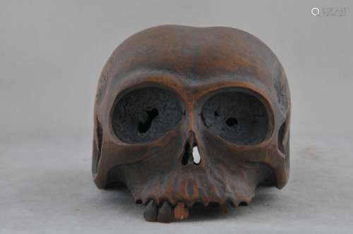 Carved wood skull with a lizard. Japan. Meiji period.