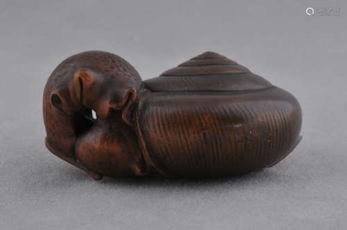 Wooden Netsuke. Japan. 19th century. Study of a snail.
