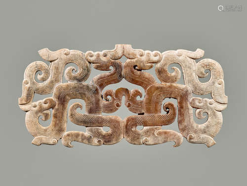 AN EXCEPTIONAL OPENWORK ORNAMENT WITH AN INTRICATE DESIGN OF DRAGONS AND BIRDS