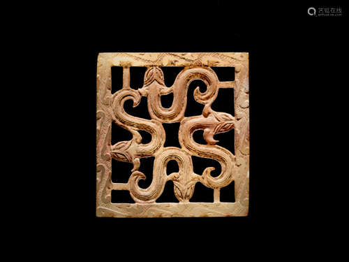 A SQUARE PLAQUE WITH AN OPENWORK PATTERN OF FOUR SNAKES