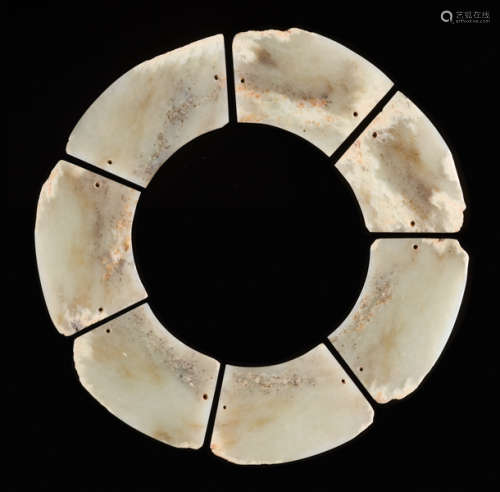 AN EXTREMELY RARE COMPOSITE DISC IN SEVEN SECTIONS CARVED FROM A BLOCK OF YELLOW-COLOURED JADE