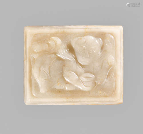 A WHITE JADE “RECLINING BOY” PENDANT, QING DYNASTY