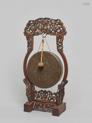 A BRONZE TEMPLE GONG WITH CARVED WOODEN FRAME, QING DYNASTY