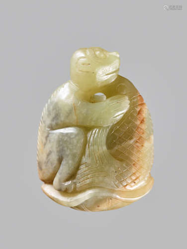 A CELADON AND RUSSET JADE ‘MONKEY AND CARP’ PENDANT