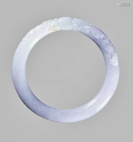 A LAVENDER JADEITE ‘DRAGON AND PEARL’ BANGLE