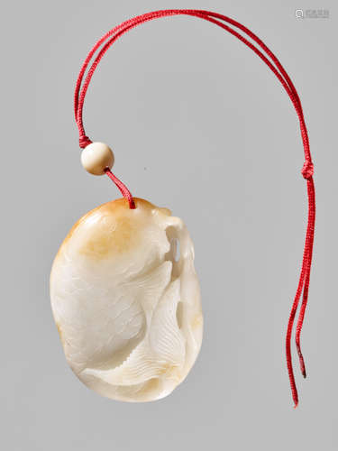 A WHITE AND RUSSET JADE ‘CARP’ PENDANT