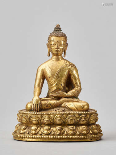 A GILT BRONZE FIGURE OF BUDDHA AKSHOBYA