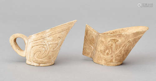 A PAIR OF CALCIFIED BONE ‘LIBATION’ CUPS