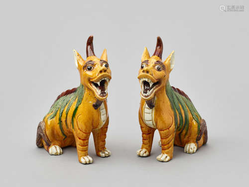 A PAIR OF SANCAI GLAZED PORCELAIN FIGURES OF QILIN, QING DYNASTY