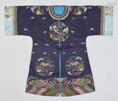 AN EMBROIDERED LONGGUA SILK LADY'S SURCOAT WITH LANDSCAPE ROUNDELS