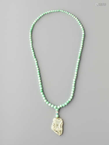 AN APPLE GREEN JADEITE NECKLACE, 108 BEADS, SUPPORTING A WHITE JADE PENDANT