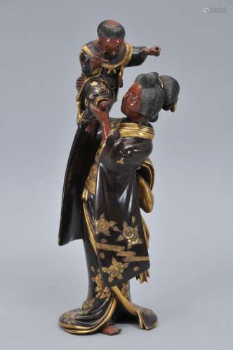 Bronze figure. Japan. Meiji period. (1868-1912). Mixed metal work. Signed. Miya-O figure of a woman and child. 12-1/2