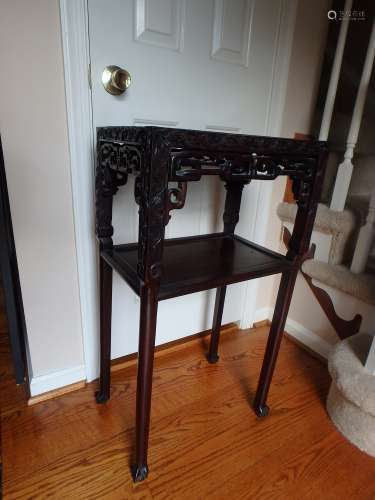 Chinese carved rose wood plant stand with marble top.