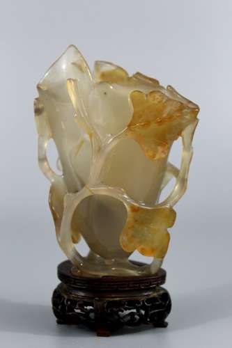 Chinese carved agate vase with wood stand, Qing Dynasty.