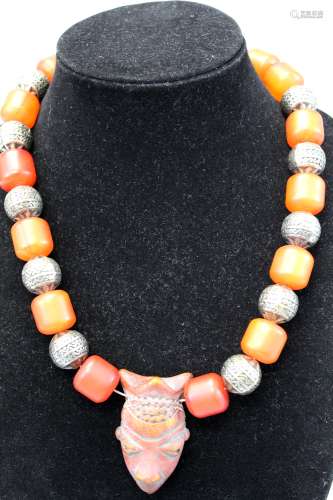 African necklace with metal bead.