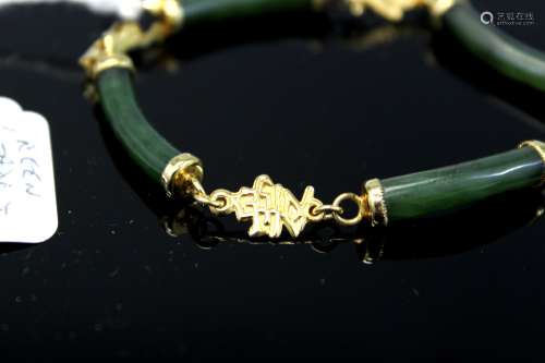 12K gold green jade bracelet.