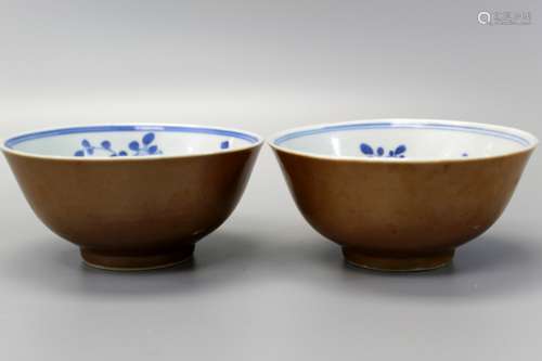 Pair of Chinese brown glazed bowls with interior blue and white decoration, Kangxi mark and of the period.