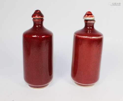 PAIR OF CHINESE SANG DE BOEUF SNUFF BOTTLES