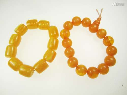 TWO PRESSED AMBER BRACELETS