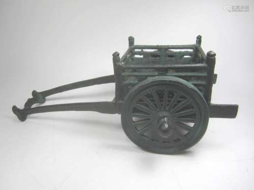 AN OLD CHINESE METAL CARRIAGE MODEL