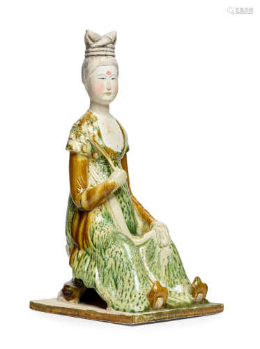 Tang dynasty A RARE SANCAI-GLAZED POTTERY FIGURE OF A COURT LADY