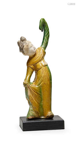 Tang dynasty, 8th century A SANCAI-GLAZED POTTERY FIGURE OF A LADY