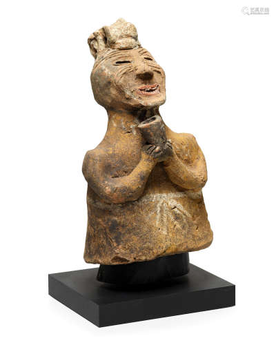 Eastern Han dynasty A PAINTED POTTERY FIGURE OF A SHAMAN