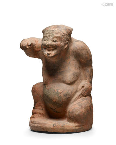 Eastern Han dynasty A SICHUAN POTTERY FIGURE OF AN ENTERTAINER