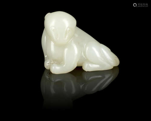 A pale green jade carving of a bear