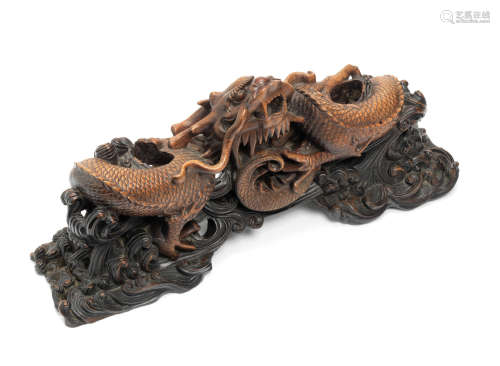 Late Qing Dynasty A deeply carved hardwood 'dragon' stand