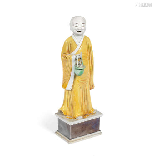 Kangxi A famille verte biscuit figure of an Immortal