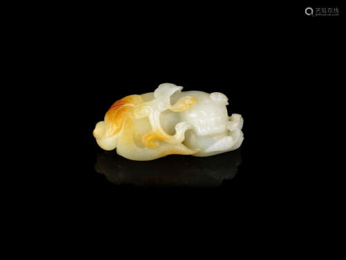 A white and russet jade carving of a Buddhist lion