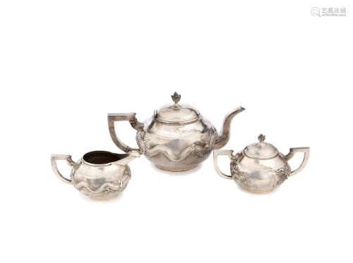 Tuck Chong stamped marks, early 20th century A Chinese export silver three-piece tea set