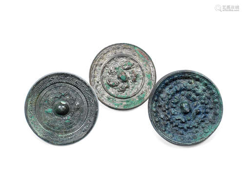 Eastern Han, Sui & Tang Dynasties Three archaic bronze 'mythical beasts' mirrors