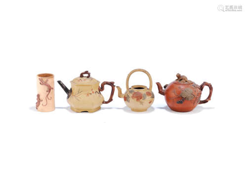 Early Qing Dynasty and later A group of three teapots and a brushpot
