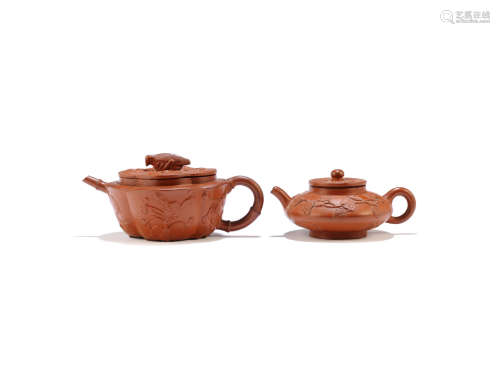 Early Qing Dynasty Two Yixing red stoneware teapots and covers with applied decoration
