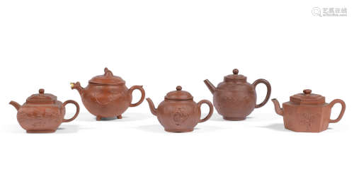 Early Qing Dynasty A group of five Yixing stoneware teapots and covers with applied decoration