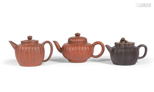 Qing Dynasty A group of Yixing melon shaped teapots and covers