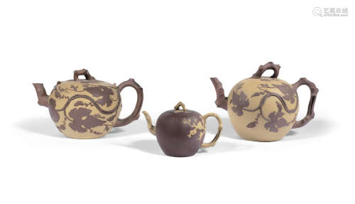 Mid Qing Dynasty A group of Yixing buff and brown clay globular teapots and covers