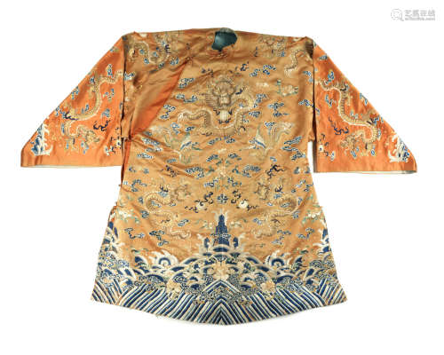 18th/19th century An apricot-ground silk embroidered 'dragon' robe
